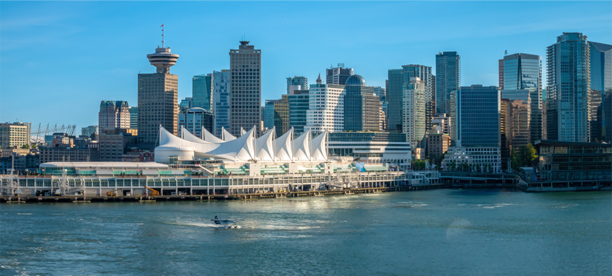 Vancouver waterfront skyline featuring Canada Place, modern high-rise buildings, and the harbour, showcasing the dynamic urban environment and lifestyle for students pursuing a masters in Vancouver.